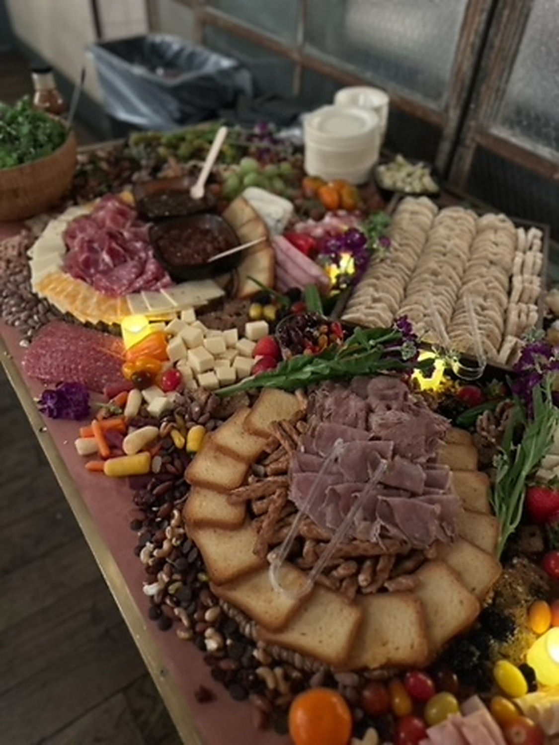 Large grazing and charcuterie table prepared by brwnbox kitchen